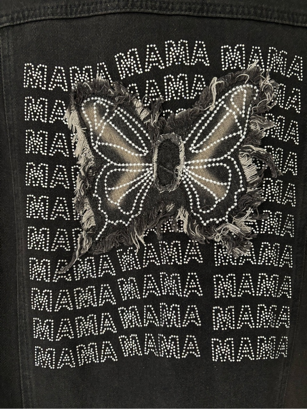 Oversized.Distressed Black Butterfly Jean Jacket with Rhinestone 'MAMA' Detail.